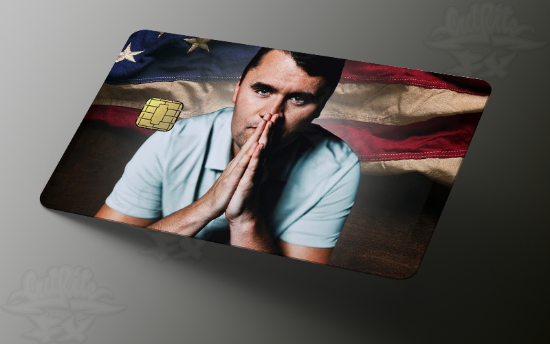A credit card skin featuring Charlie Kirk with hands together in a prayer-like pose, set against a rustic American flag background with a cut-out for the EMV chip.