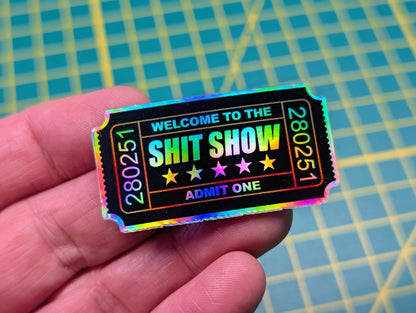 Holographic vinyl sticker shaped like an admission ticket with funny text