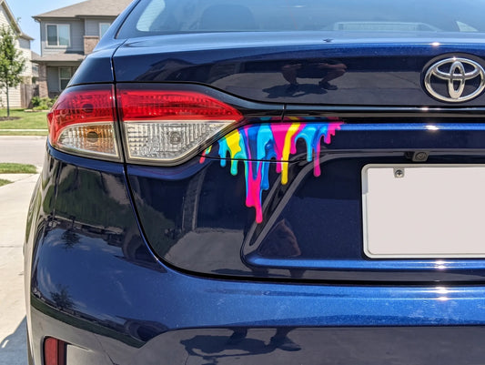 Blue car with colorful paint design on the trunk