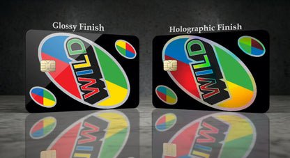 Two black cards labeled 'Glossy Finish' and 'Holographic Finish' with a colorful oval logo reading 'UNO WILD' and small multicolor circular graphics, shown on a dark reflective surface.